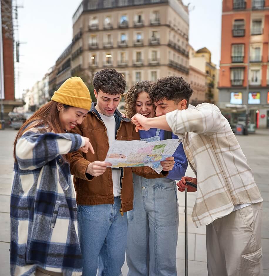 joyful friends exploring a new city on vacation