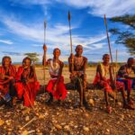 african warriors sitting spears