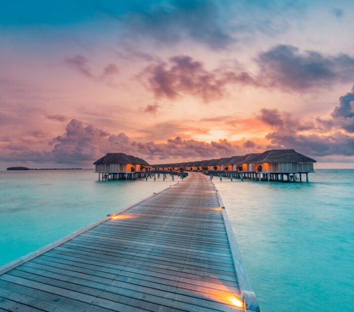 maldives sunset water villas